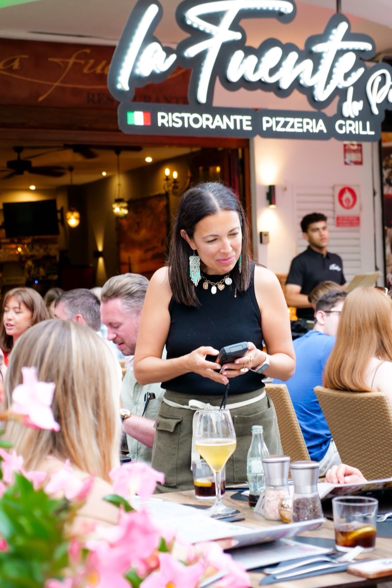 Brenda serving drinks on the terrace at La Fuente Nerja