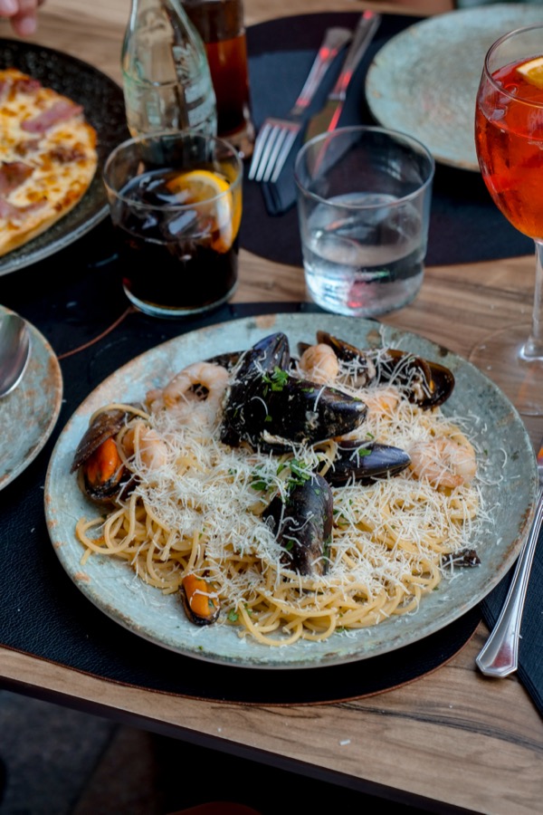 Guests enjoying a meal together at La Fuente